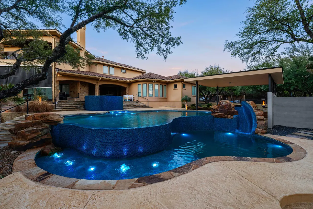 Boulder Slide — Family freeform pool in Tarrytown, TX by GB IV Designs