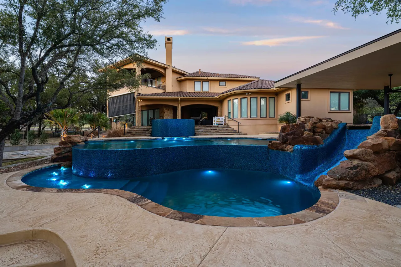Boulder Slide — Family freeform pool in Tarrytown, TX by GB IV Designs (photo 2)