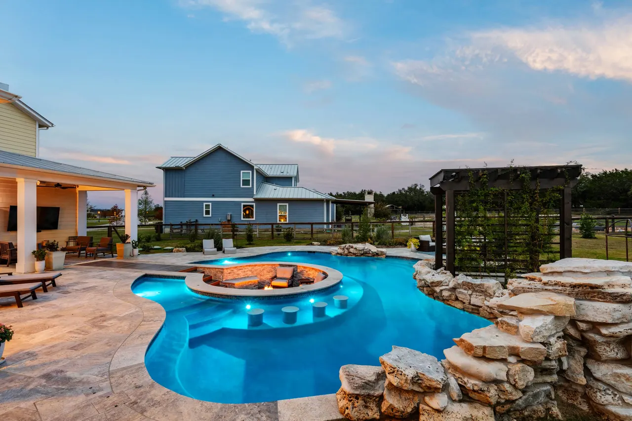 Farmhouse Lagoon — Freeform pool with sunken lounge in Travis County, TX by GB IV Designs (photo 3)