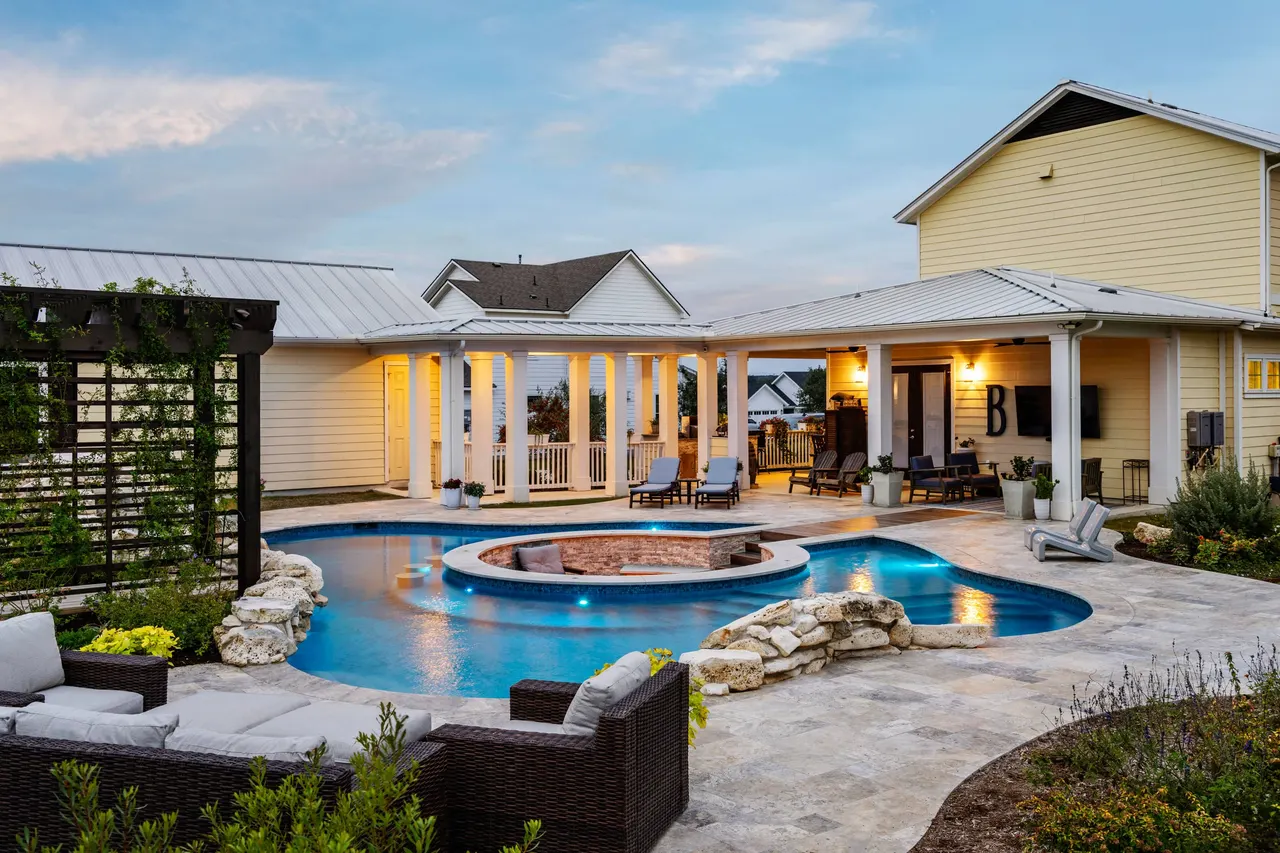 Farmhouse Lagoon — Freeform pool with sunken lounge in Travis County, TX by GB IV Designs (photo 4)