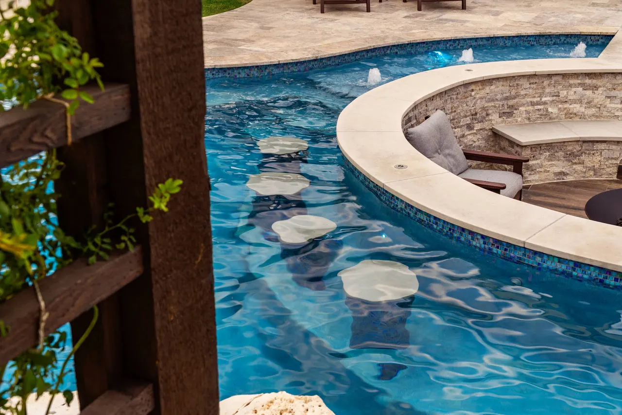 Farmhouse Lagoon — Freeform pool with sunken lounge in Travis County, TX by GB IV Designs (photo 10)