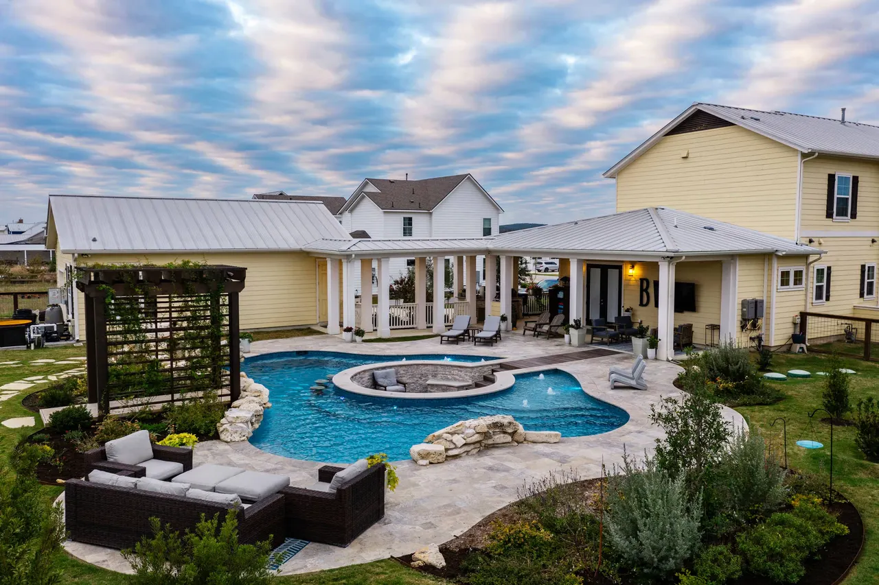 Farmhouse Lagoon — Freeform pool with sunken lounge in Travis County, TX by GB IV Designs (photo 16)