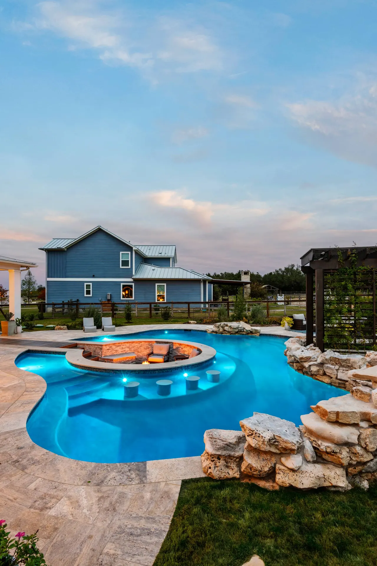Farmhouse Lagoon — Freeform pool with sunken lounge in Travis County, TX by GB IV Designs (photo 18)
