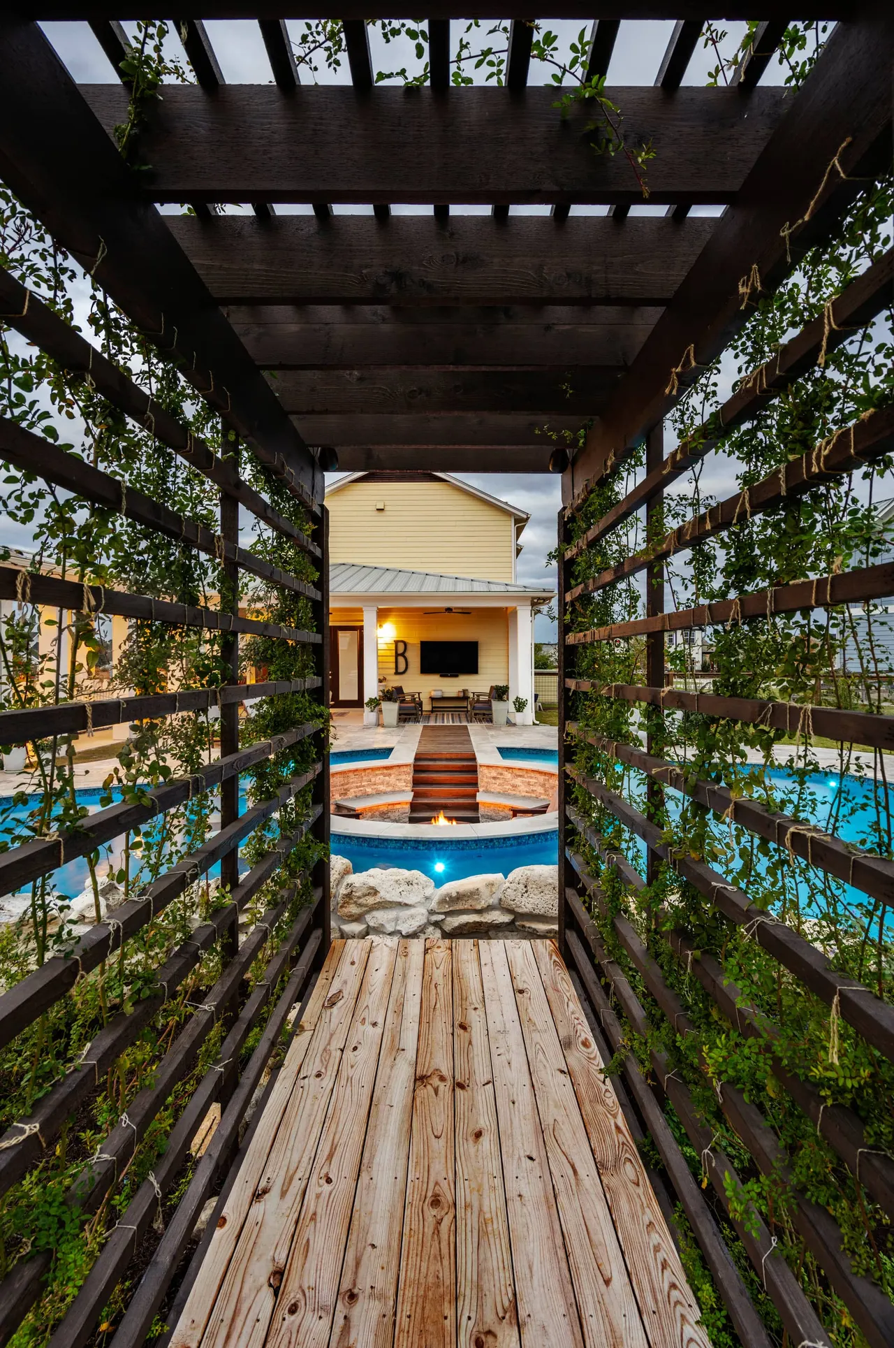 Farmhouse Lagoon — Freeform pool with sunken lounge in Travis County, TX by GB IV Designs (photo 19)