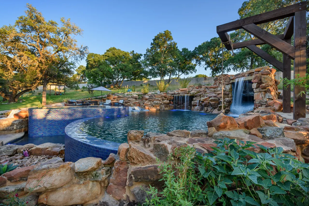 Grotto Waterfall — Freeform pool & grotto in Texas Hill Country, TX by GB IV Designs