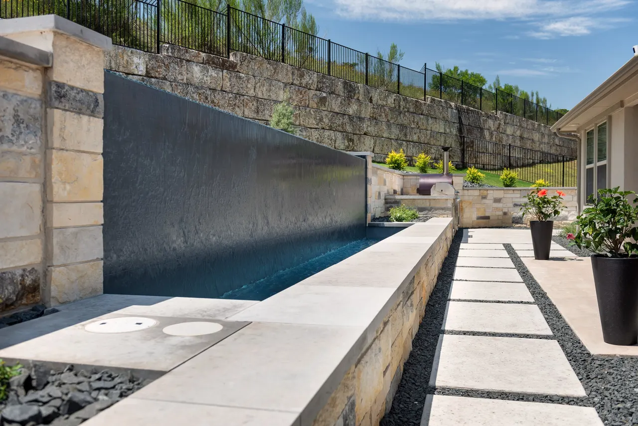 Limestone Terrace — Geometric pool with raised spa in Austin, TX by GB IV Designs (photo 1)