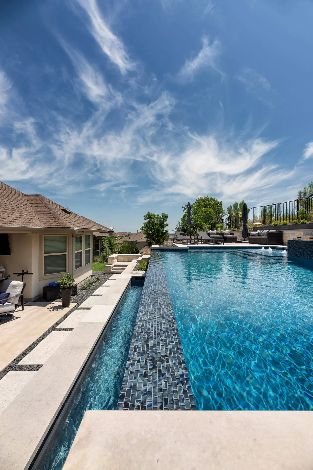 Limestone Terrace — Geometric pool with raised spa in Austin, TX by GB IV Designs (photo 19)