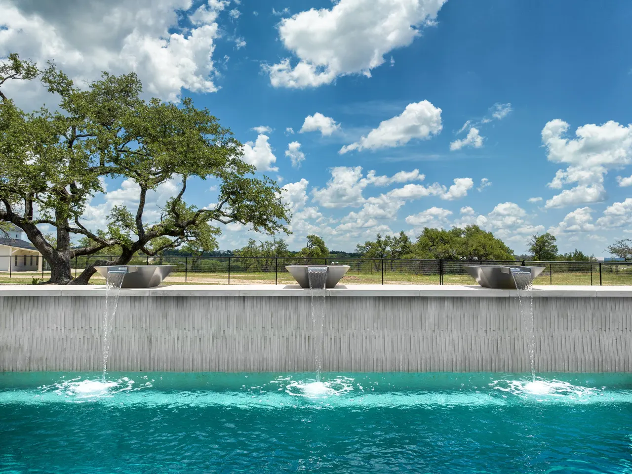 Sculpted Water Walls — Contemporary pool with water features in Bee Cave, TX by GB IV Designs (photo 4)