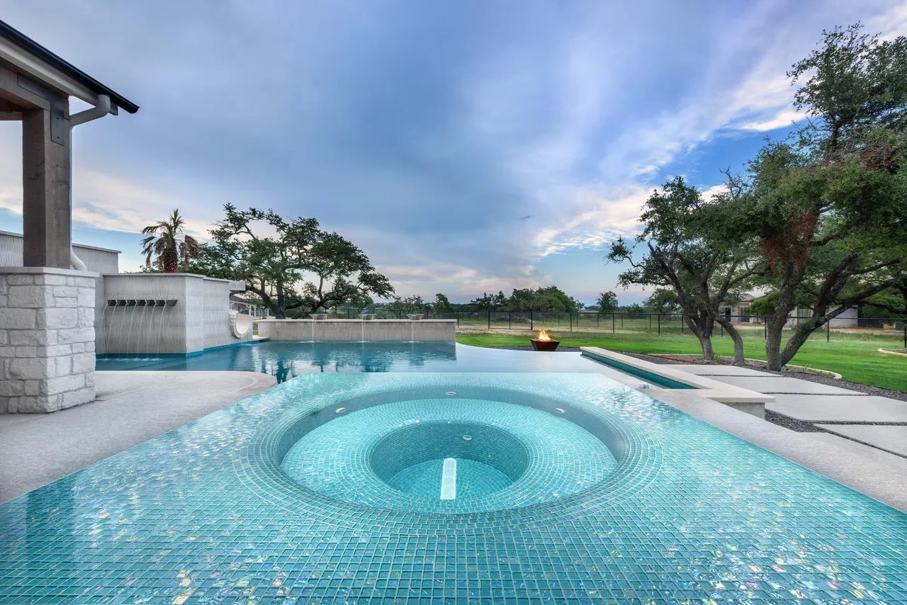 Sculpted Water Walls — Contemporary pool with water features in Bee Cave, TX by GB IV Designs (photo 9)