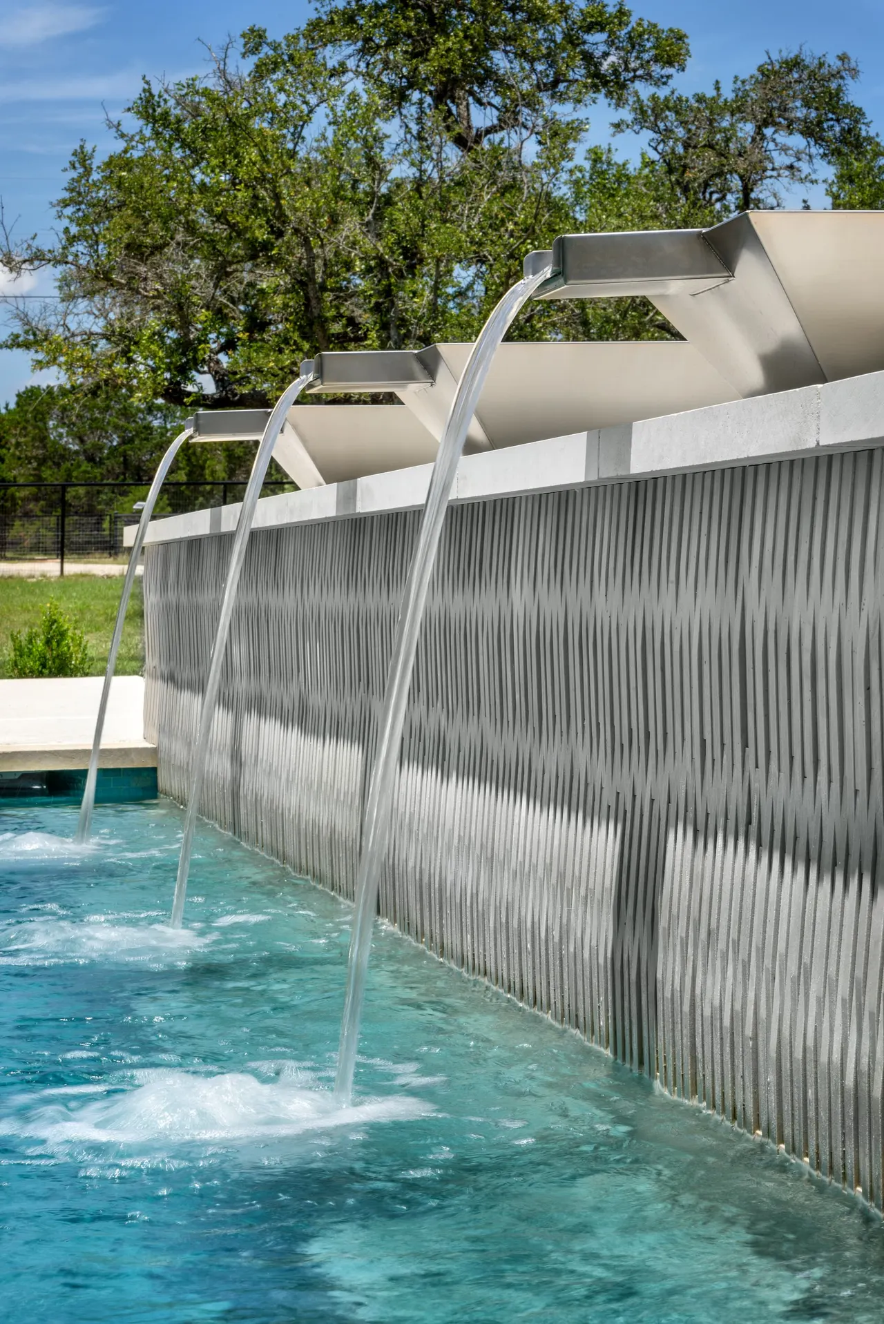 Sculpted Water Walls — Contemporary pool with water features in Bee Cave, TX by GB IV Designs (photo 18)