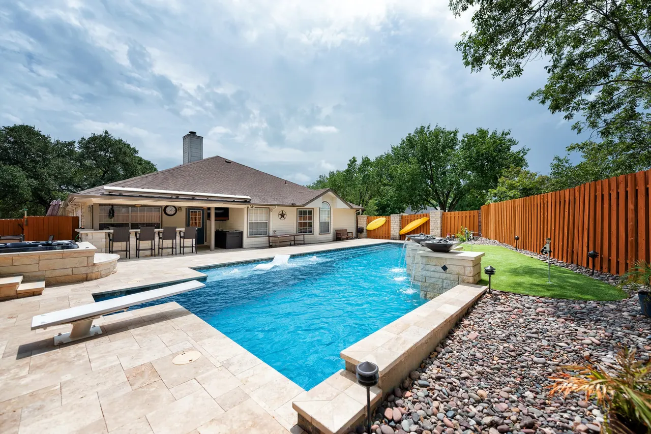 Travertine Lap — Lap pool & spa in Bee Cave, TX by GB IV Designs (photo 3)