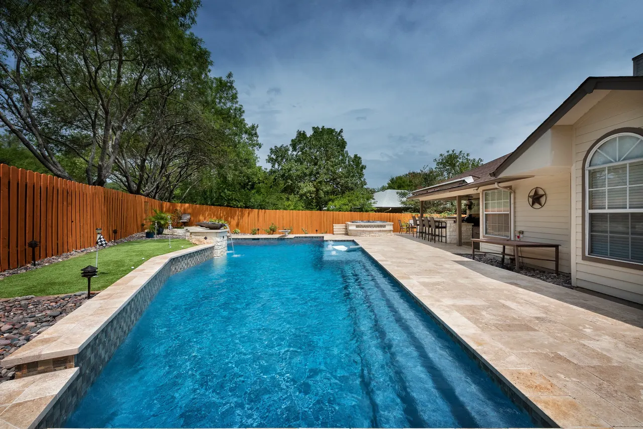 Travertine Lap — Lap pool & spa in Bee Cave, TX by GB IV Designs